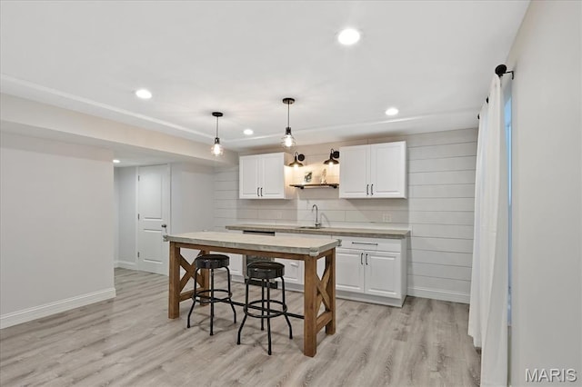 472 Cypress Creek Ln, Imperial, MO 63052 - kitchen with a sink, light wood finished floors, white cabinetry, light countertops, and recessed lighting