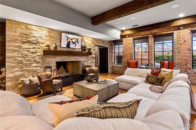 429 N Euclid Ave, Saint Louis, MO 63108 - living area featuring wood finished floors, beamed ceiling, plenty of natural light, a stone fireplace, and recessed lighting