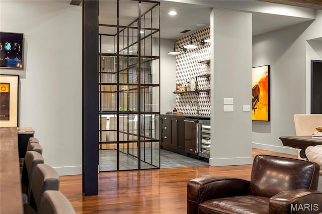 429 N Euclid Ave, Saint Louis, MO 63108 - living area featuring a dry bar, baseboards, wood finished floors, and recessed lighting