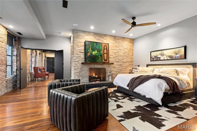 429 N Euclid Ave, Saint Louis, MO 63108 - bedroom with wood finished floors, a fireplace, and recessed lighting