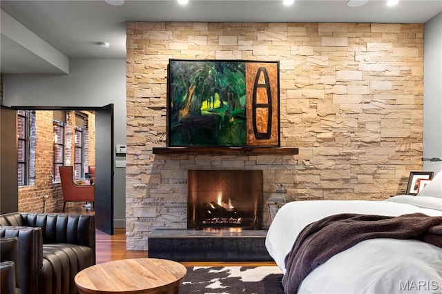 429 N Euclid Ave, Saint Louis, MO 63108 - bedroom featuring wood finished floors, a fireplace, and recessed lighting