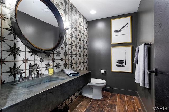429 N Euclid Ave, Saint Louis, MO 63108 - half bath with wood finished floors, a sink, toilet, and recessed lighting