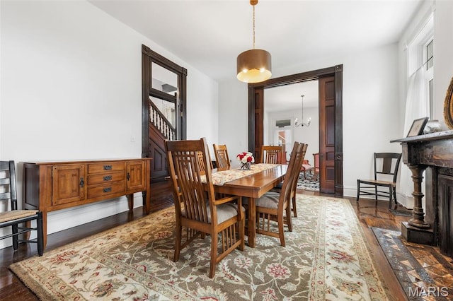 dining area with wood finished floors
