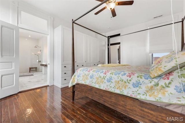 bedroom with hardwood / wood-style floors, a ceiling fan, and ensuite bathroom