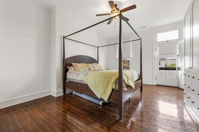 bedroom featuring wood-type flooring, baseboards, and a ceiling fan