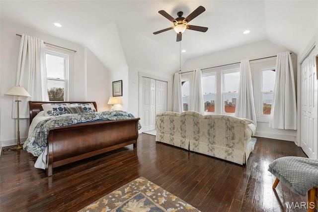 bedroom with lofted ceiling, dark wood-type flooring, ceiling fan, and baseboards