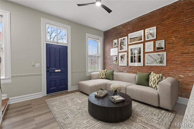914 Russell Blvd, Saint Louis, MO 63104 - living room featuring ceiling fan, wood finished floors, and brick wall