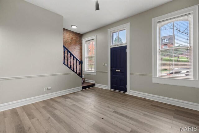 914 Russell Blvd, Saint Louis, MO 63104 - entrance foyer with stairs, wood finished floors, and a ceiling fan