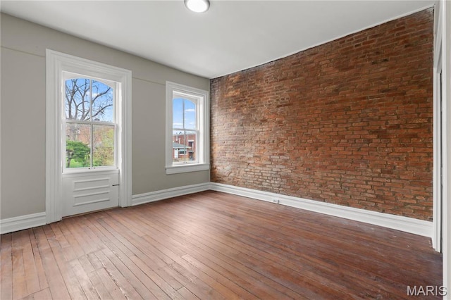 914 Russell Blvd, Saint Louis, MO 63104 - spare room featuring baseboards and wood-type flooring
