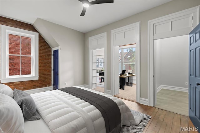 914 Russell Blvd, Saint Louis, MO 63104 - bedroom with brick wall, light wood finished floors, and ceiling fan