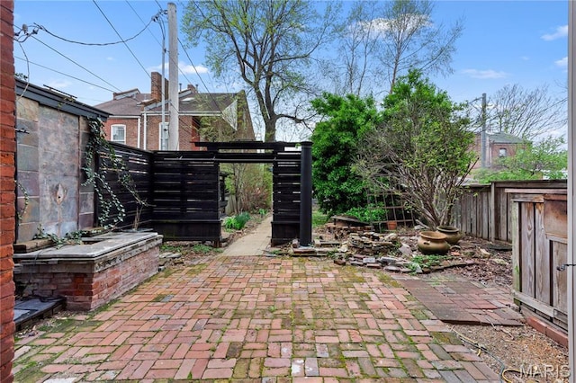 914 Russell Blvd, Saint Louis, MO 63104 - fenced backyard with a patio area