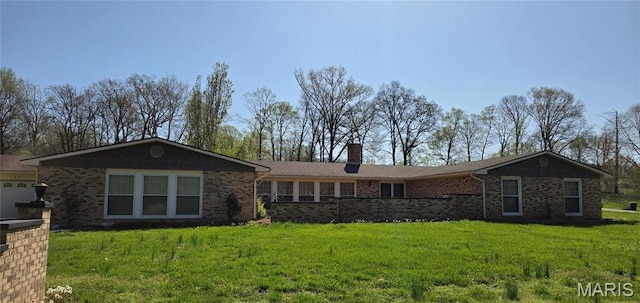185 Garnet Ln, Cape Girardeau, MO 63701 - ranch-style home featuring brick siding, a front yard, and a chimney