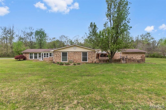 185 Garnet Ln, Cape Girardeau, MO 63701 - back of property featuring a yard and brick siding