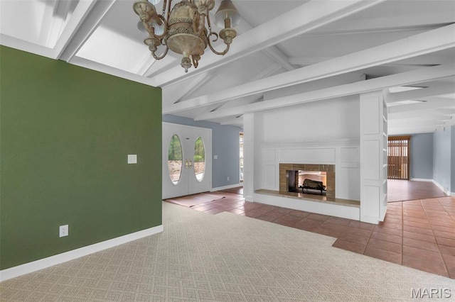 185 Garnet Ln, Cape Girardeau, MO 63701 - unfurnished living room featuring a chandelier, healthy amount of natural light, tile patterned flooring, and baseboards