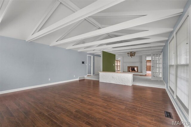 185 Garnet Ln, Cape Girardeau, MO 63701 - unfurnished living room featuring a multi sided fireplace, baseboards, and wood finished floors
