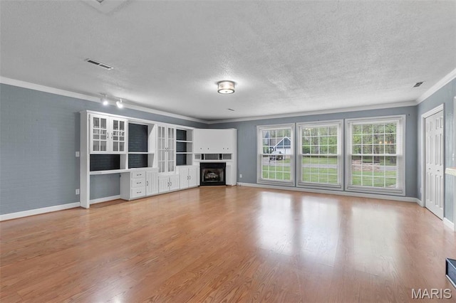 185 Garnet Ln, Cape Girardeau, MO 63701 - unfurnished living room with a textured ceiling, crown molding, wood finished floors, baseboards, and a fireplace