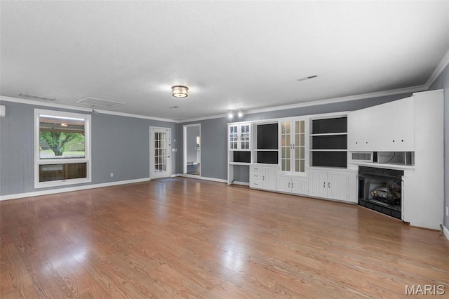 185 Garnet Ln, Cape Girardeau, MO 63701 - unfurnished living room with crown molding, wood finished floors, a fireplace, baseboards, and attic access