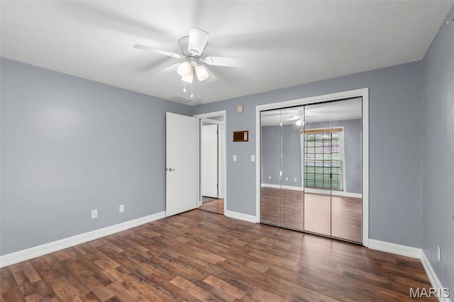185 Garnet Ln, Cape Girardeau, MO 63701 - unfurnished bedroom featuring wood finished floors, baseboards, a closet, and a ceiling fan