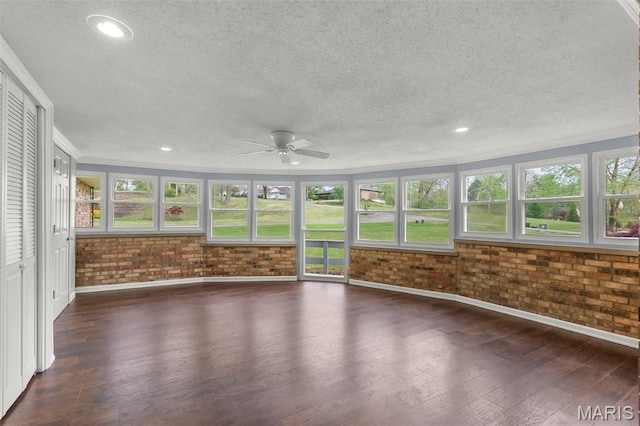 185 Garnet Ln, Cape Girardeau, MO 63701 - unfurnished sunroom with baseboards, wood finished floors, a textured ceiling, ornamental molding, and brick wall