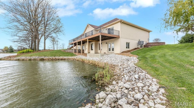 304 Wood Duck Ct, Waterloo, IL 62298 - back of house featuring a yard, a deck with water view, and a patio area