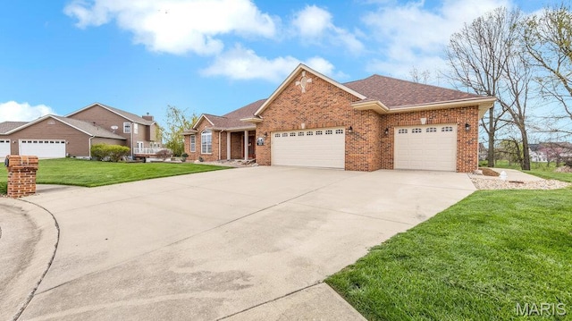 304 Wood Duck Ct, Waterloo, IL 62298 - view of front facade with brick siding, an attached garage, a front yard, and concrete driveway