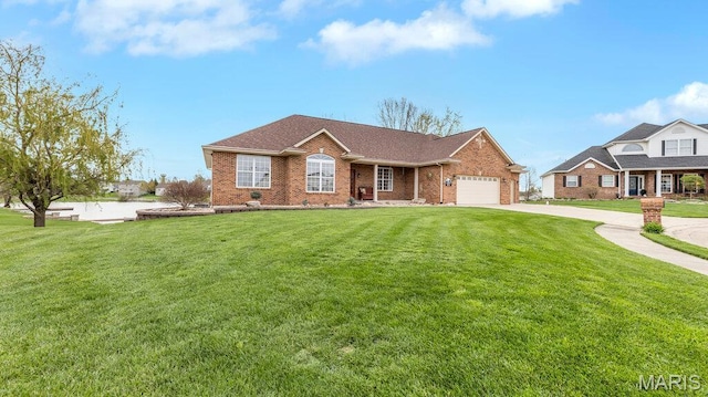 304 Wood Duck Ct, Waterloo, IL 62298 - single story home featuring brick siding, concrete driveway, a front yard, and an attached garage