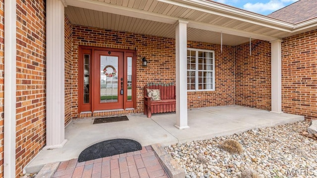 304 Wood Duck Ct, Waterloo, IL 62298 - doorway to property with brick siding, a porch, and roof with shingles