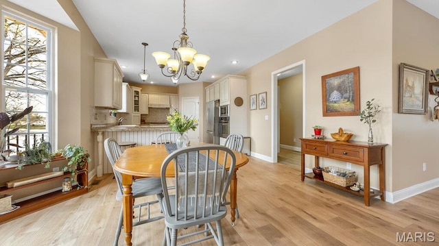 304 Wood Duck Ct, Waterloo, IL 62298 - dining area featuring a chandelier, baseboards, light wood-type flooring, and recessed lighting
