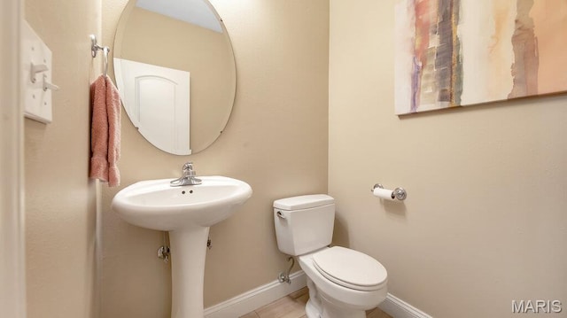 304 Wood Duck Ct, Waterloo, IL 62298 - half bathroom featuring toilet, baseboards, and a sink