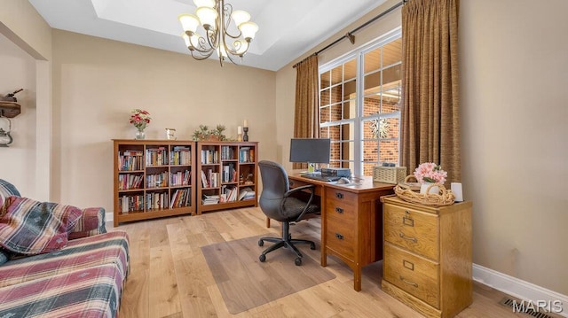 304 Wood Duck Ct, Waterloo, IL 62298 - office space featuring wood finished floors, a chandelier, and baseboards