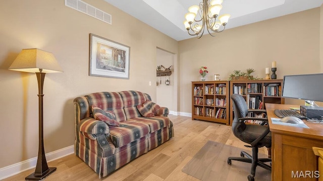 304 Wood Duck Ct, Waterloo, IL 62298 - office space featuring a chandelier, light wood-style floors, and baseboards