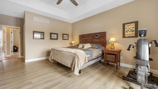 304 Wood Duck Ct, Waterloo, IL 62298 - bedroom with baseboards, wood finished floors, ceiling fan, and a raised ceiling