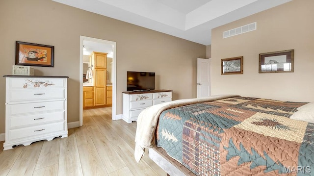 304 Wood Duck Ct, Waterloo, IL 62298 - bedroom featuring light wood-style floors, ensuite bathroom, and baseboards