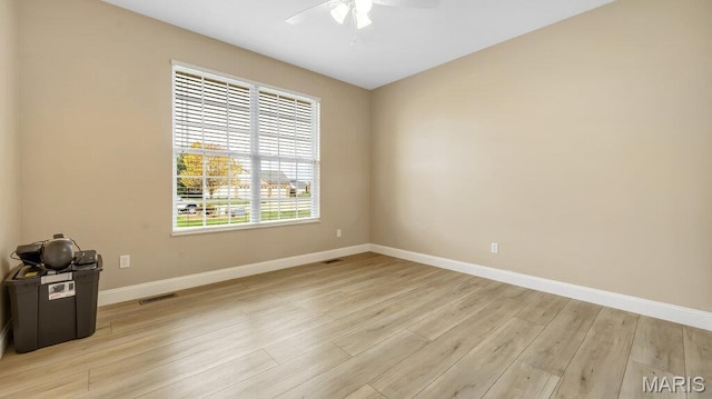 304 Wood Duck Ct, Waterloo, IL 62298 - spare room featuring baseboards, light wood-style floors, and ceiling fan