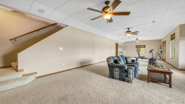 304 Wood Duck Ct, Waterloo, IL 62298 - living room featuring carpet floors, a drop ceiling, ceiling fan, baseboards, and stairs