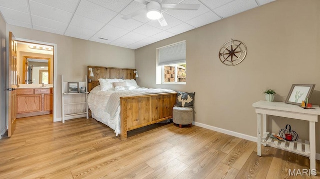 304 Wood Duck Ct, Waterloo, IL 62298 - bedroom featuring light wood finished floors, baseboards, and a drop ceiling