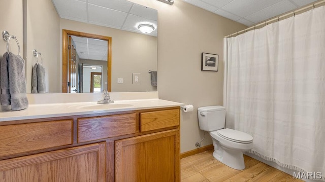 304 Wood Duck Ct, Waterloo, IL 62298 - full bathroom with a paneled ceiling, toilet, vanity, wood finished floors, and baseboards