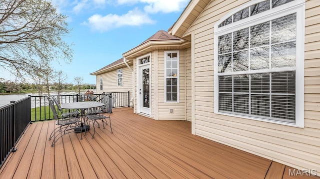 304 Wood Duck Ct, Waterloo, IL 62298 - wooden deck with outdoor dining area and a water view