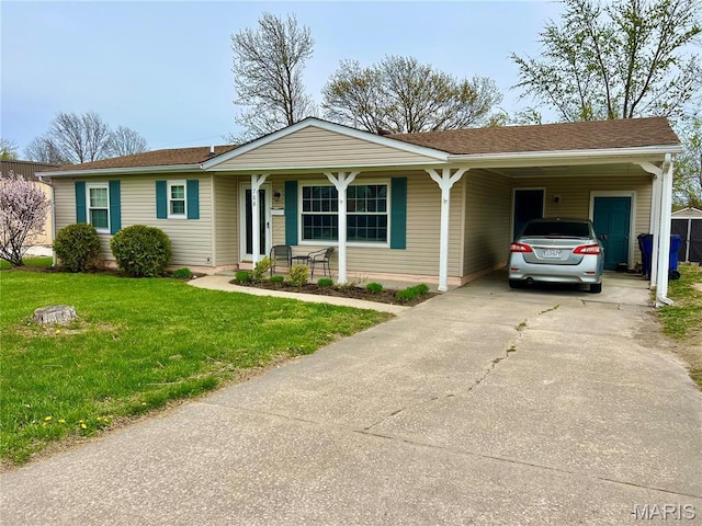 single story home featuring a front yard, a carport, concrete driveway, and covered porch
