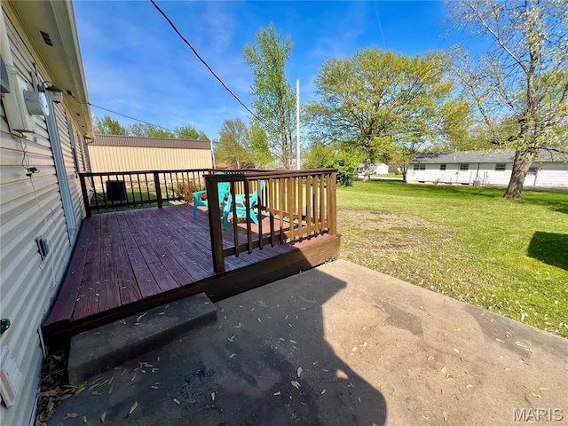 wooden terrace with a yard