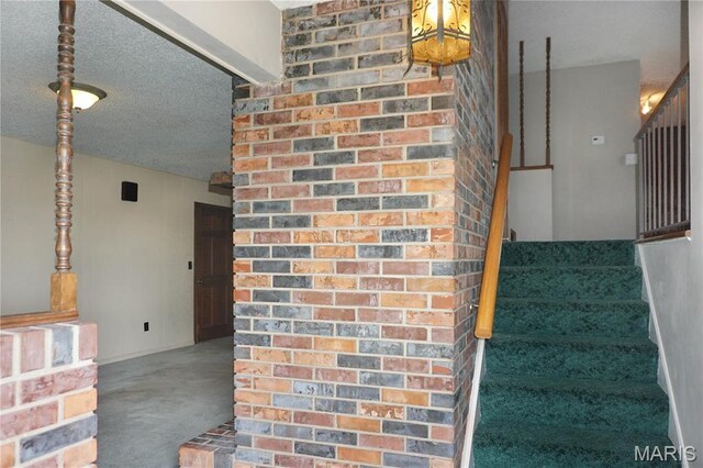 1502 Independence Rd, Rolla, MO 65401 - stairway with carpet floors and a textured ceiling