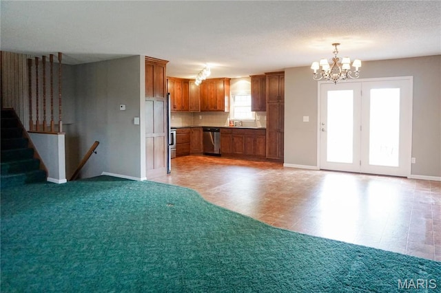 1502 Independence Rd, Rolla, MO 65401 - kitchen with dishwasher, a chandelier, brown cabinetry, baseboards, and open floor plan