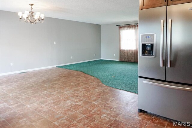 1502 Independence Rd, Rolla, MO 65401 - kitchen featuring stainless steel fridge with ice dispenser, a chandelier, carpet flooring, and baseboards