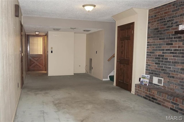 1502 Independence Rd, Rolla, MO 65401 - carpeted empty room featuring a textured ceiling, stairway, and baseboards