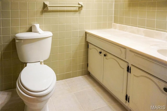 1502 Independence Rd, Rolla, MO 65401 - bathroom with vanity, tile walls, toilet, and tile patterned flooring