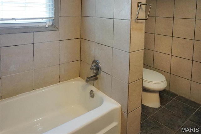1502 Independence Rd, Rolla, MO 65401 - bathroom with tile walls, toilet, and tile patterned flooring