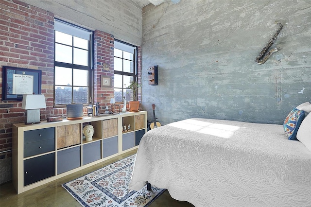 bedroom with finished concrete flooring and a towering ceiling