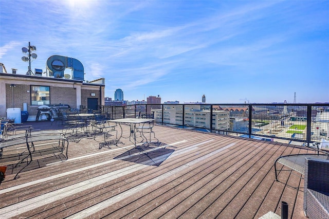 deck with outdoor dining space