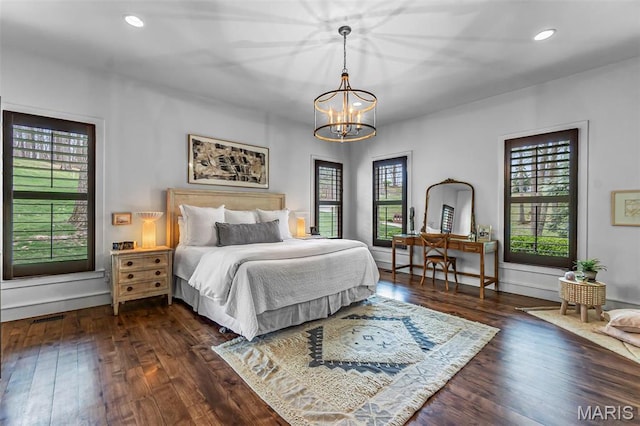 323 White Oaks Ln, Cape Girardeau, MO 63701 - bedroom featuring multiple windows, dark wood-style floors, a chandelier, recessed lighting, and baseboards