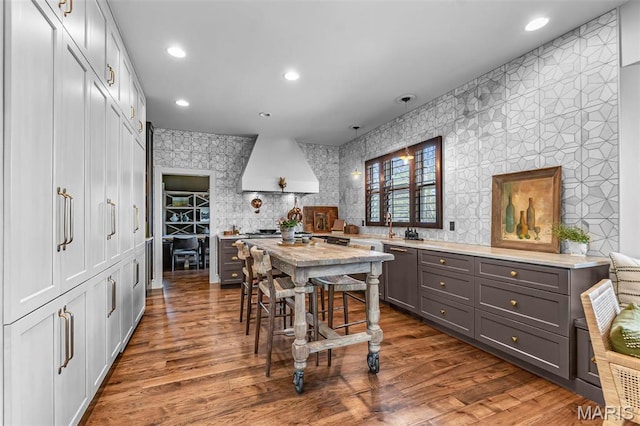 323 White Oaks Ln, Cape Girardeau, MO 63701 - kitchen featuring custom range hood, gray cabinetry, a sink, dark wood-style floors, and recessed lighting